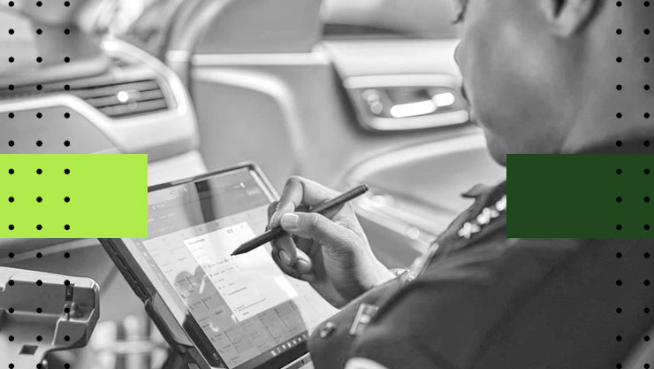 A police officer working on his tablet