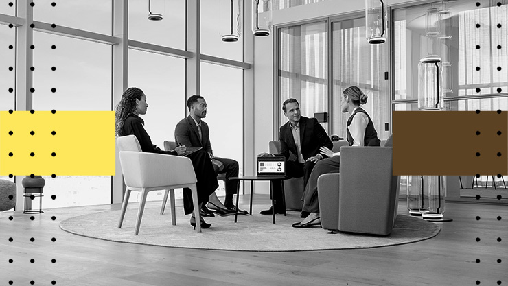 A group of people having a discussion around a table